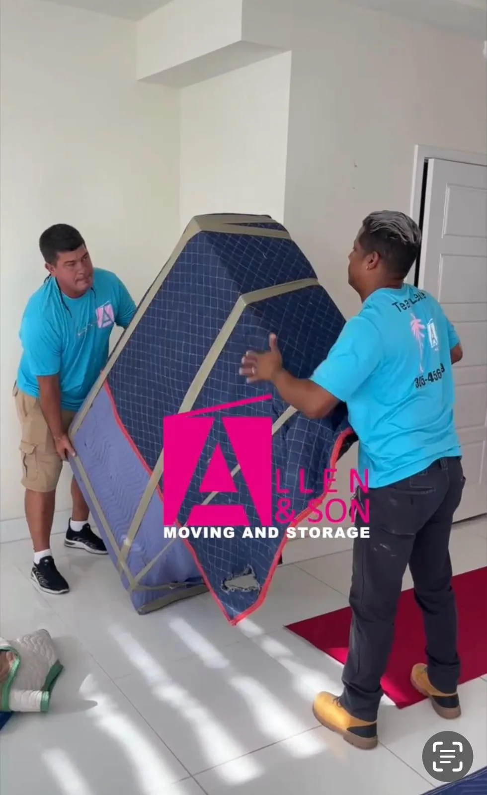 Allen & Son movers carrying a pad-wrapped item, company logo overlay